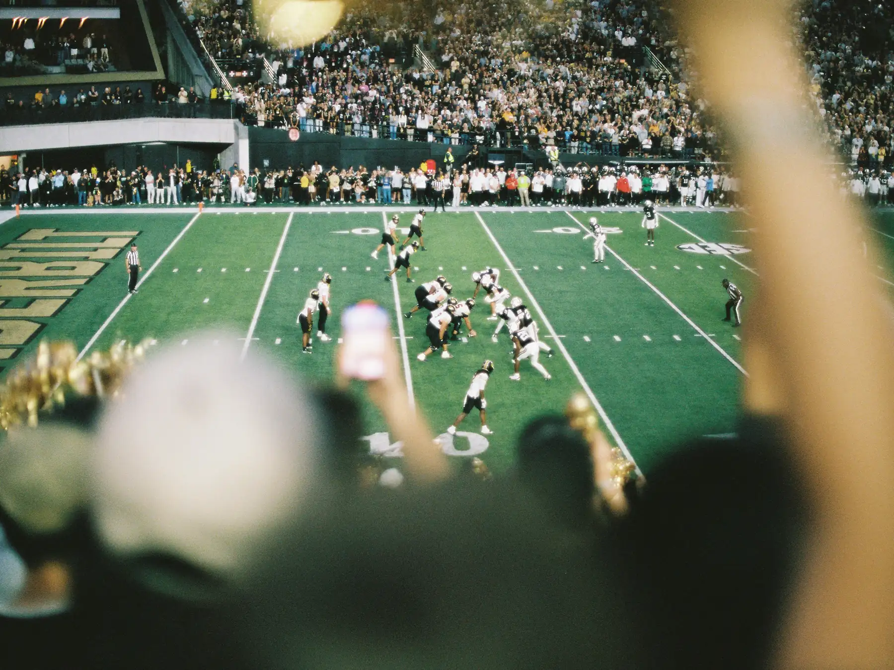 American football game in a stadium