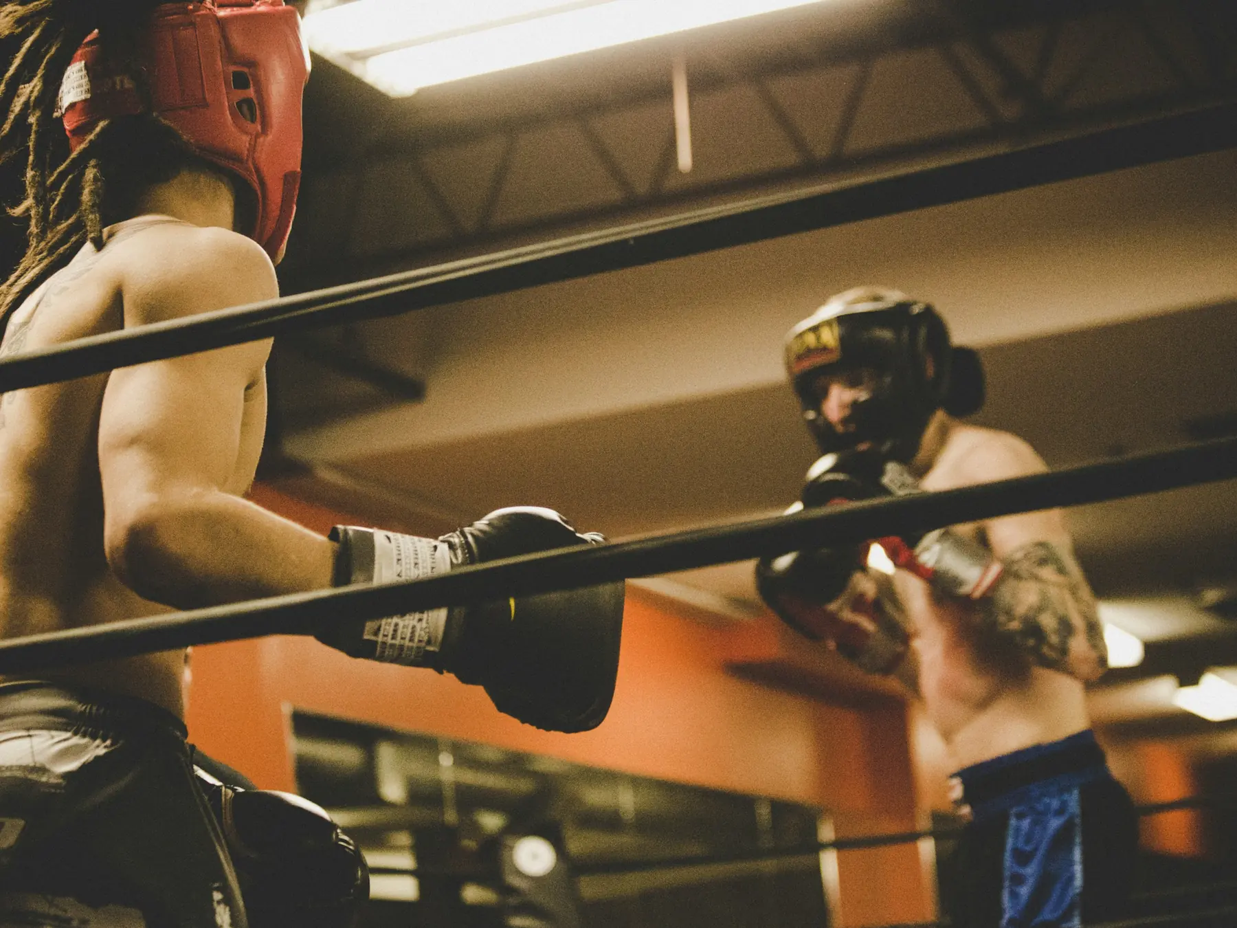 Boxers sparring in a gym