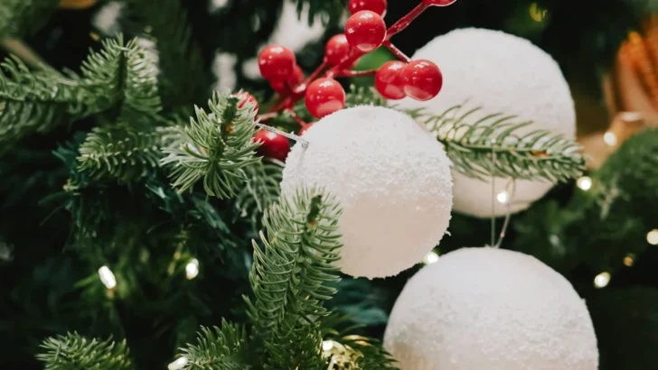 Fresh evergreen Christmas greenery arranged with holiday ornaments