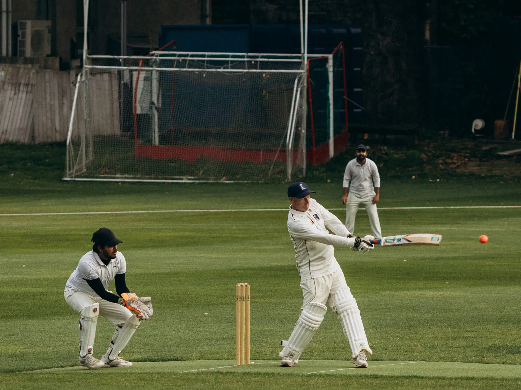 Cricket batter playing a shot during a match