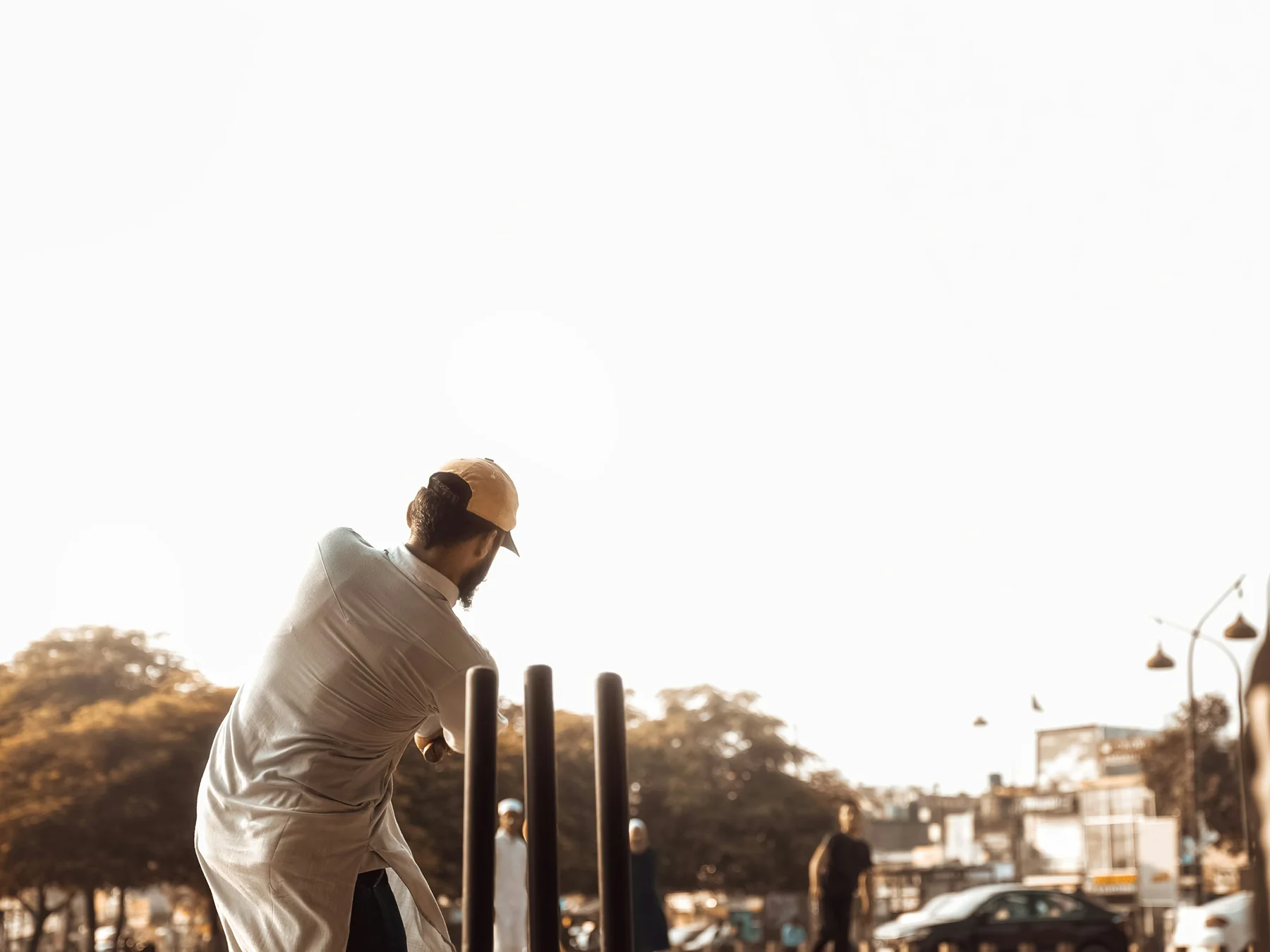 Cricket player batting beside the wicket