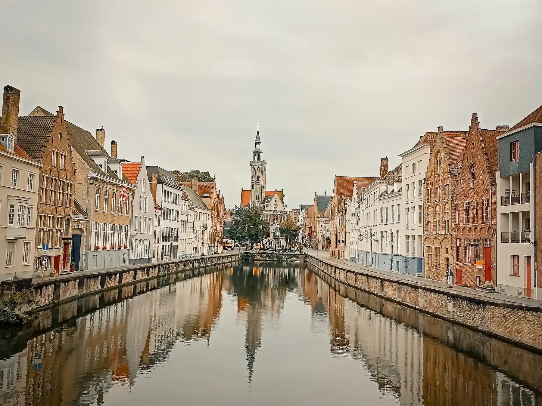 Historic buildings reflected in a canal in Bruges, Belgium