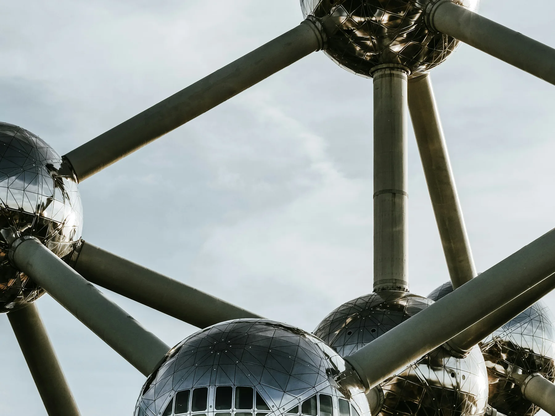 Close view of the silver spheres and tubes of the Atomium in Brussels