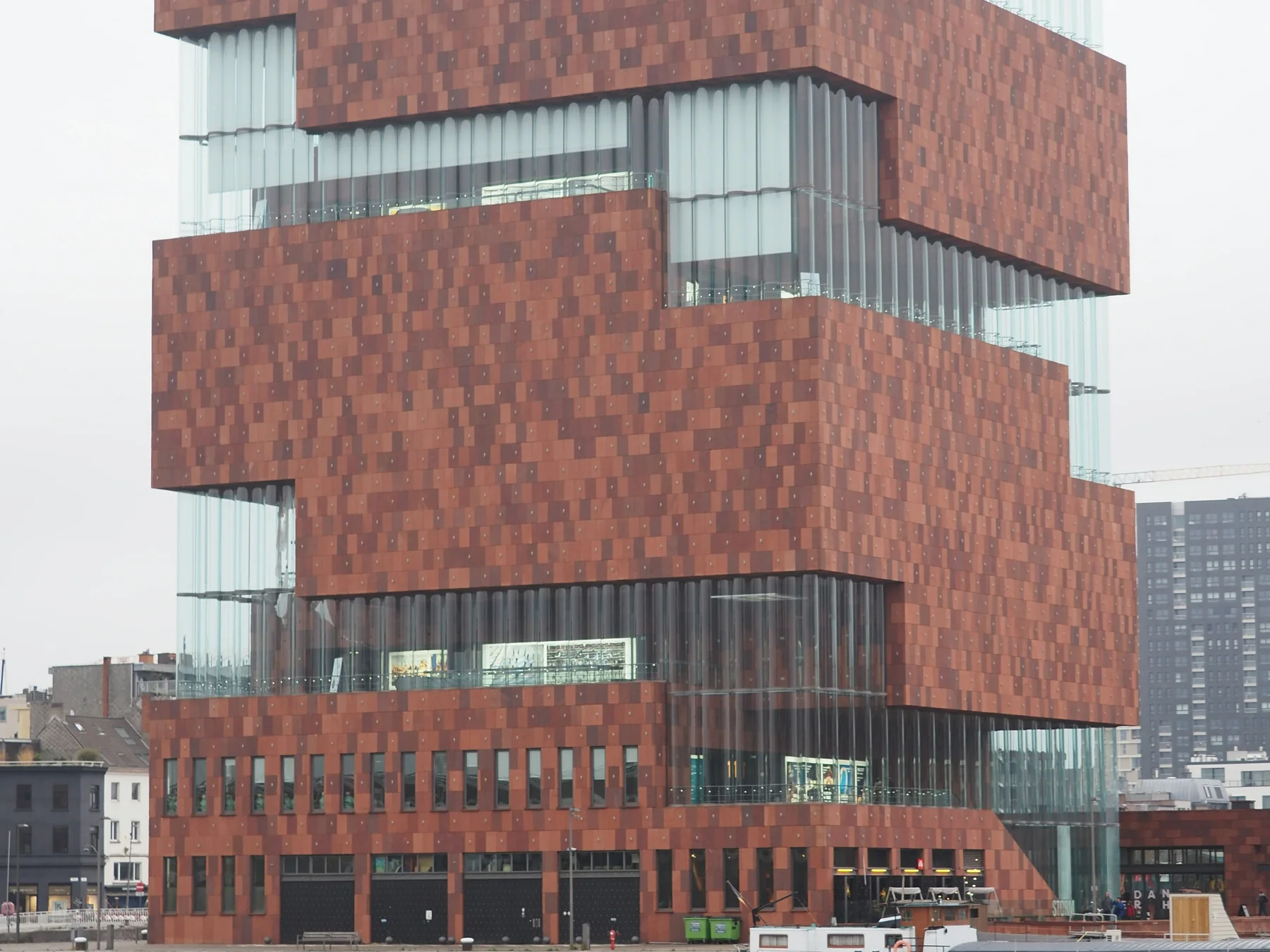 Red sandstone facade of Museum aan de Stroom in Antwerp, Belgium