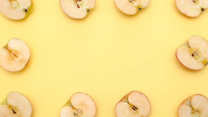 Fresh apple halves arranged before being turned into cider