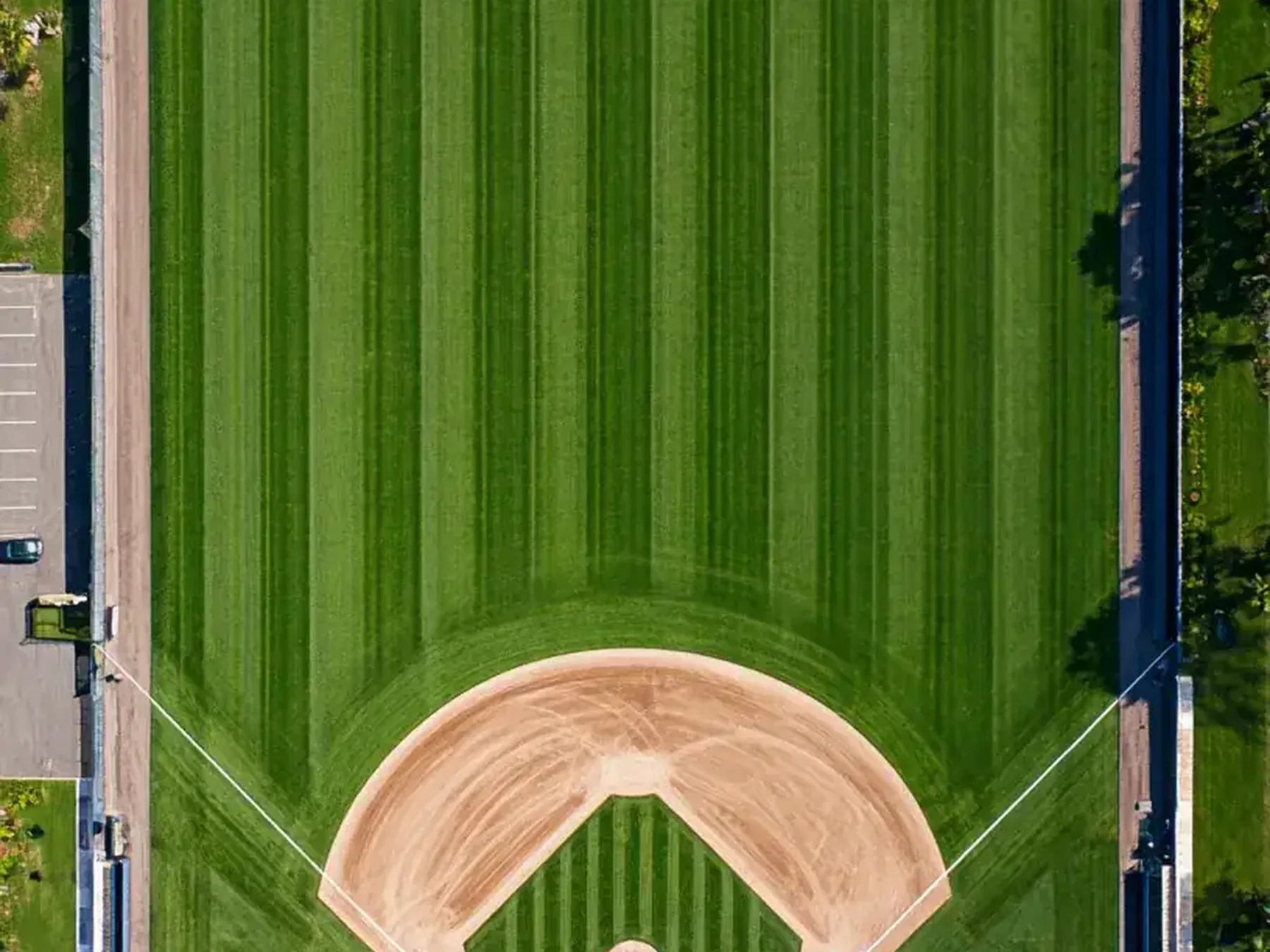 Aerial view of a carefully striped baseball field and infield diamond