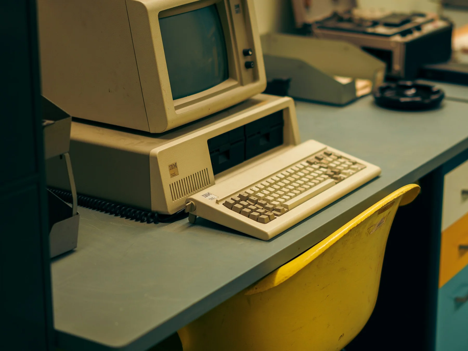 Vintage beige desktop computer with a CRT monitor, floppy drives, and keyboard