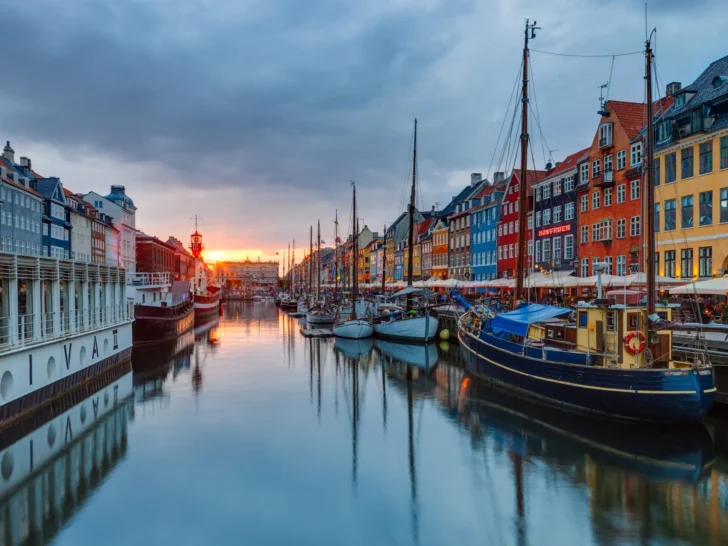 Colorful buildings and boats lining Nyhavn harbor in Copenhagen, Denmark