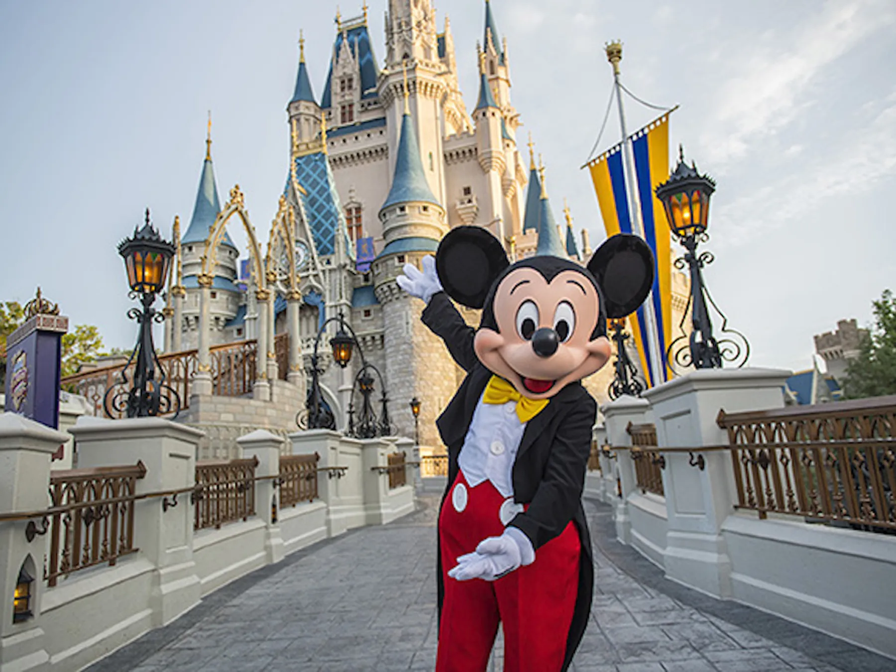 Mickey Mouse in front of Cinderella Castle