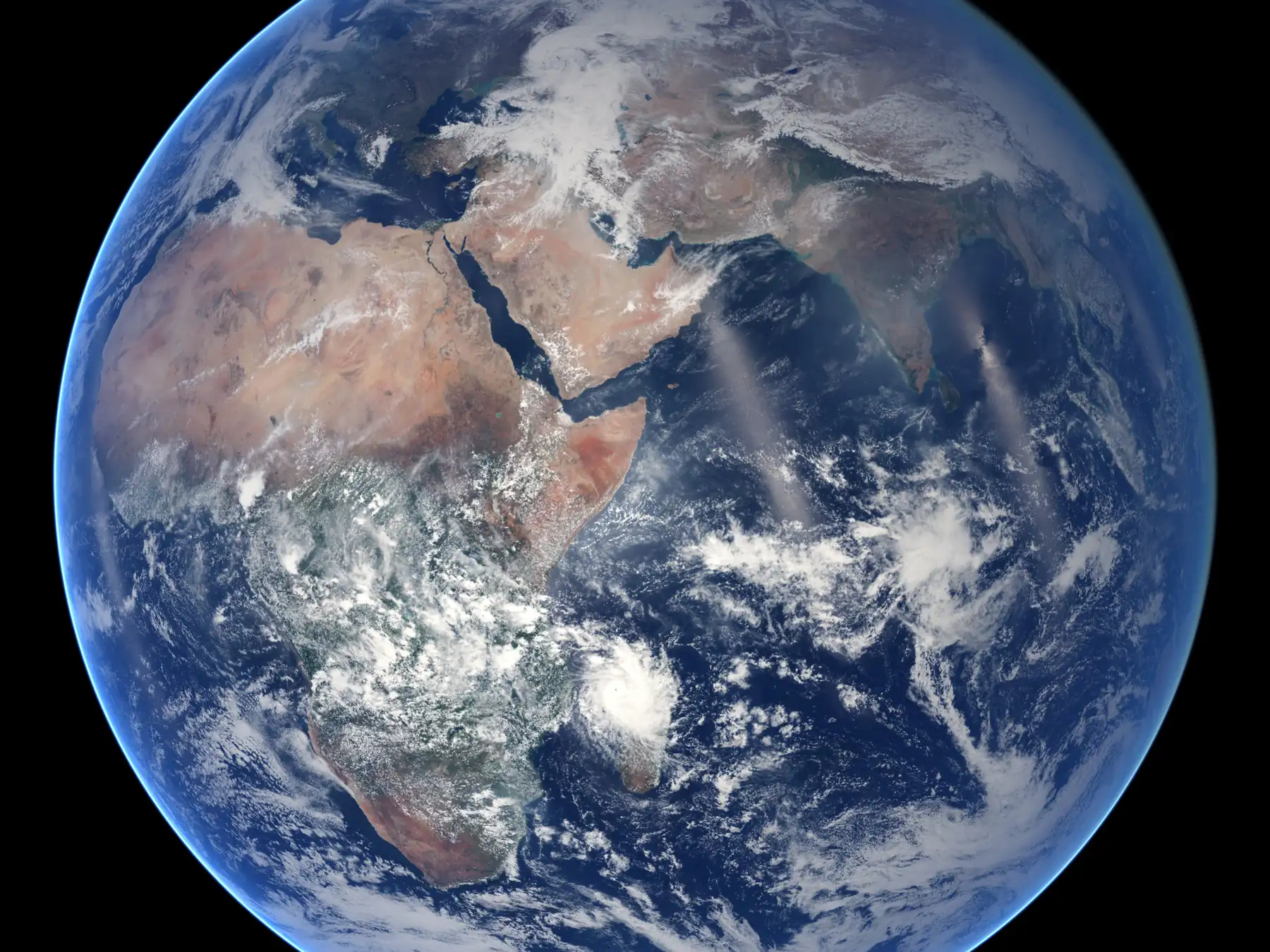 Full-disk view of Earth showing Africa, Europe, Asia, oceans, and clouds