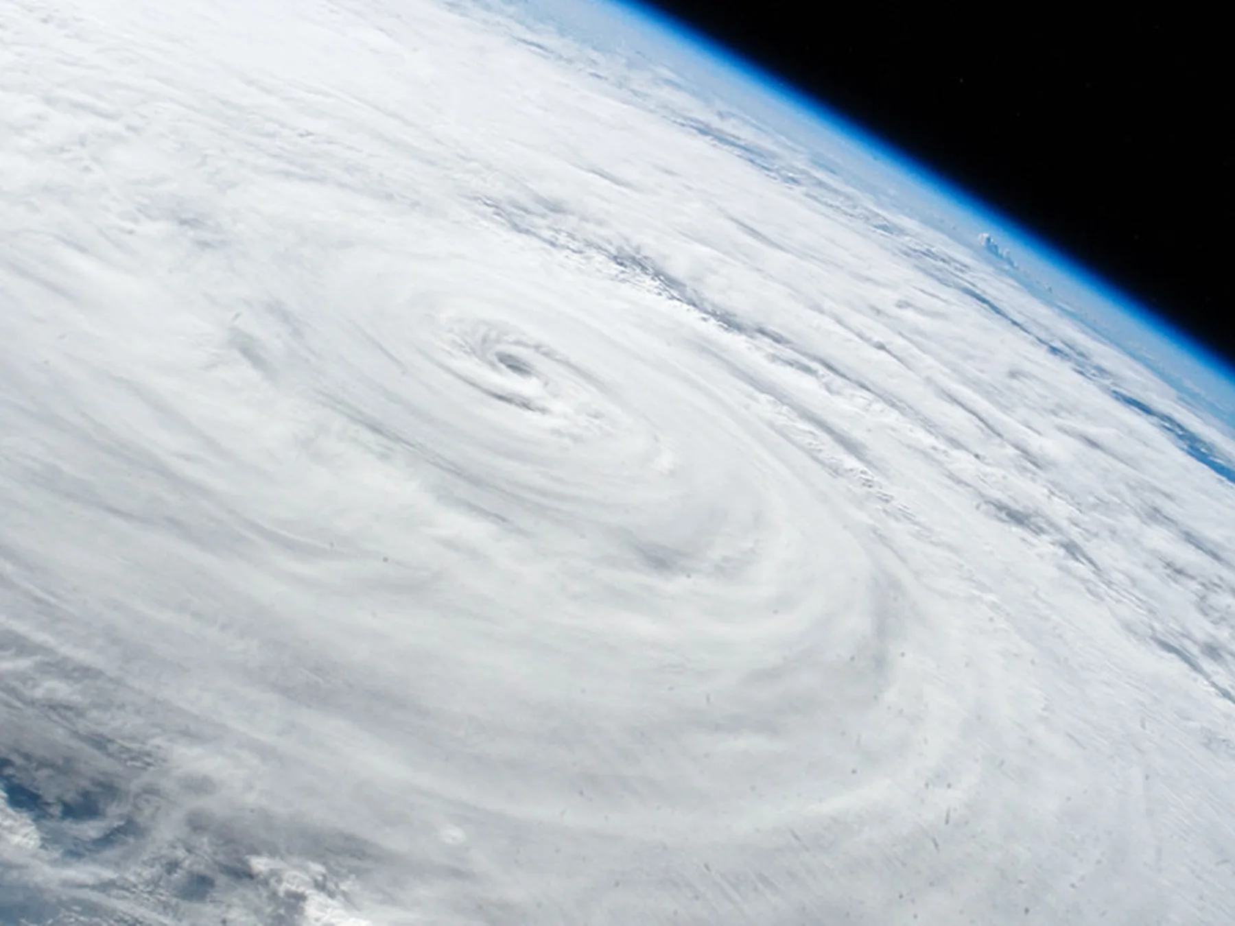 Large typhoon swirling above Earth as seen from orbit