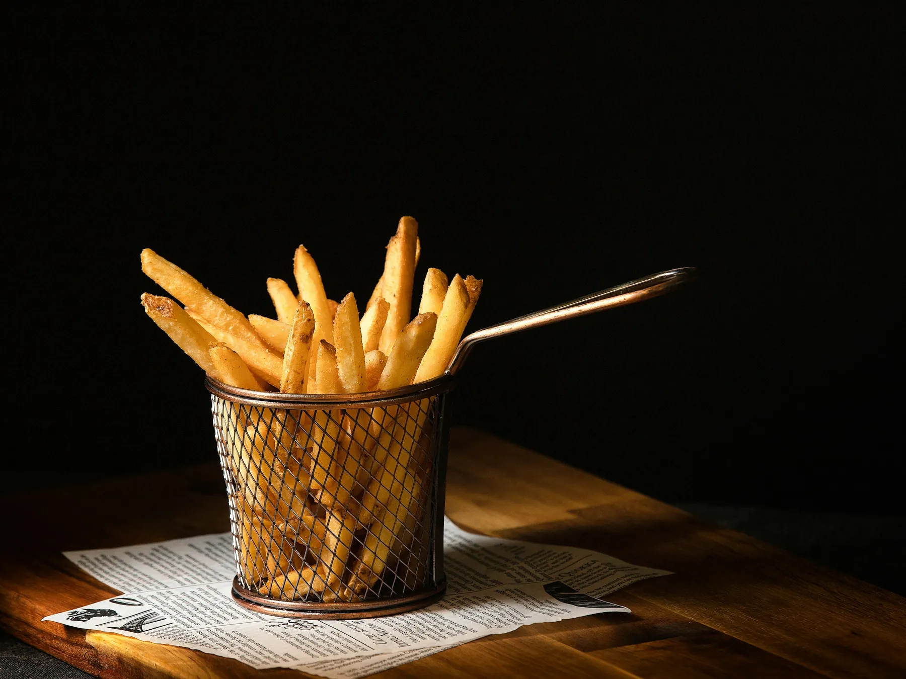 French fries served in a metal basket