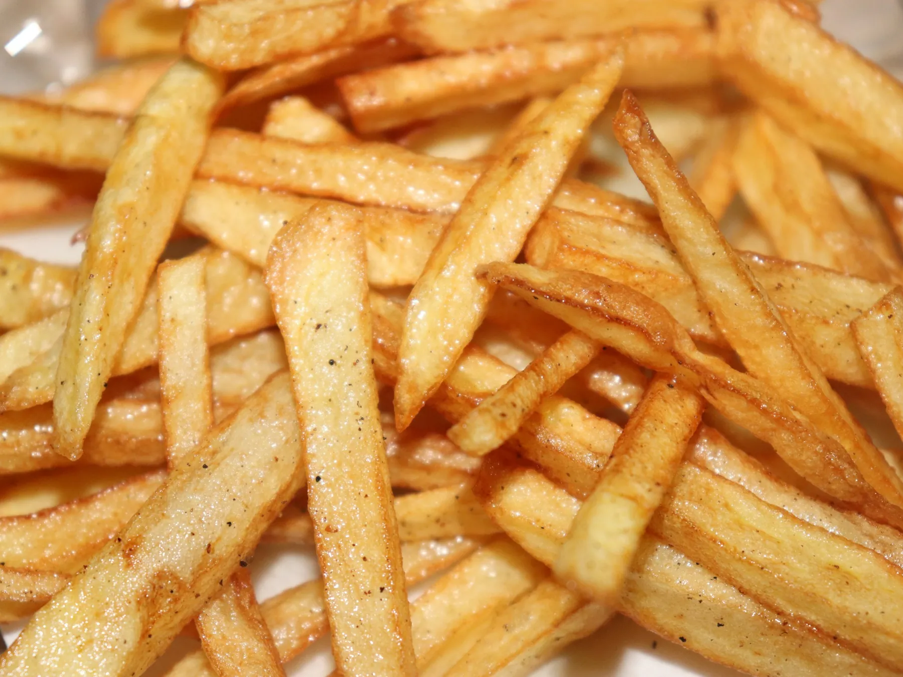 Close-up of golden seasoned French fries