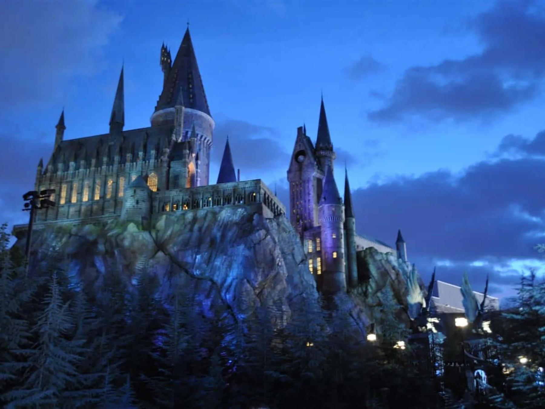 Hogwarts Castle glowing above a snowy village