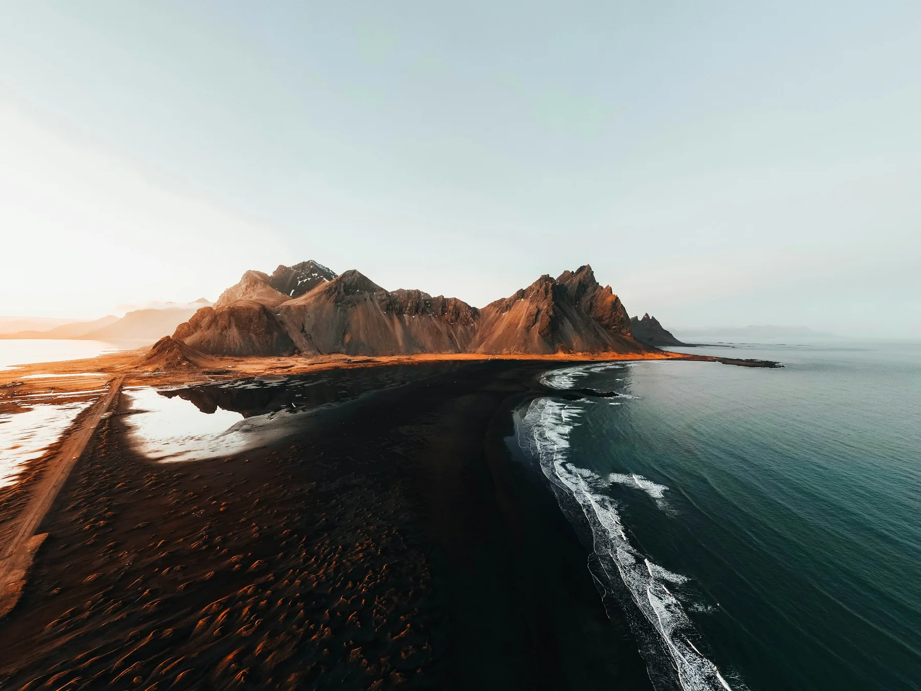 Black sand coastline and mountains in Iceland