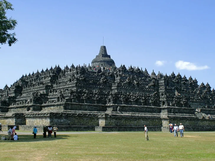 Borobudur Buddhist temple in Indonesia under a blue sky