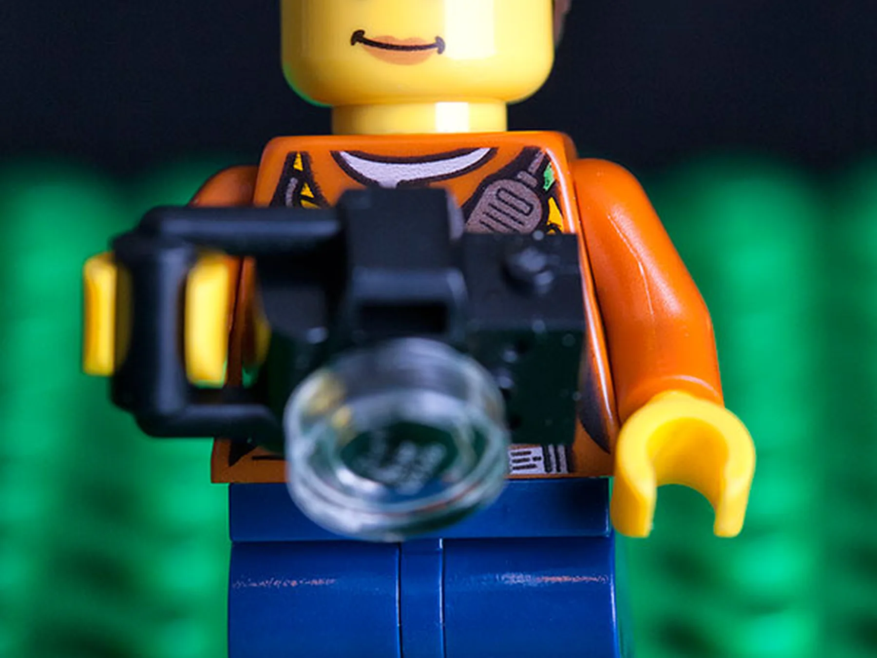 LEGO minifigure holding a camera