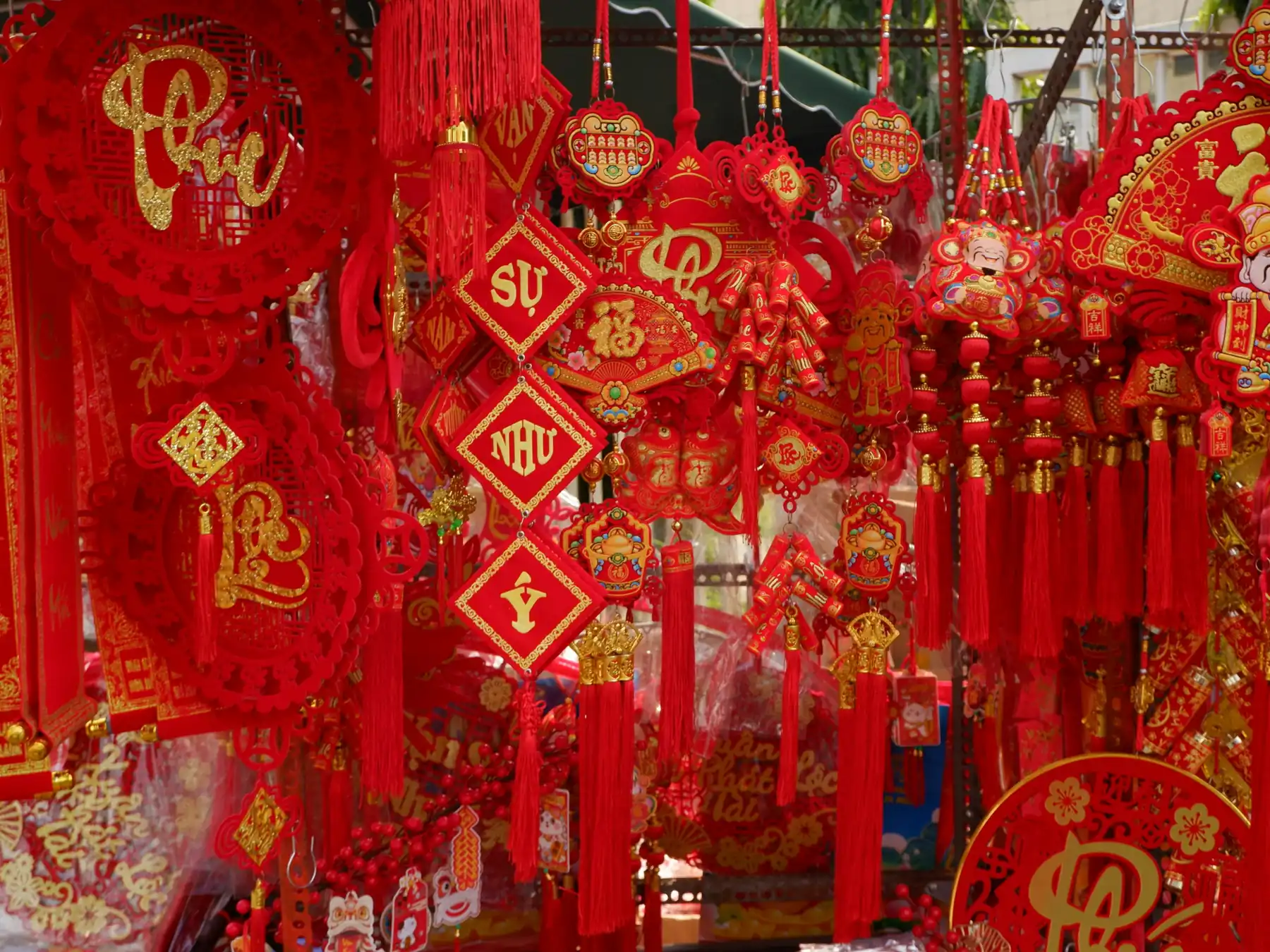 Rows of red and gold lanterns and ornaments for Lunar New Year
