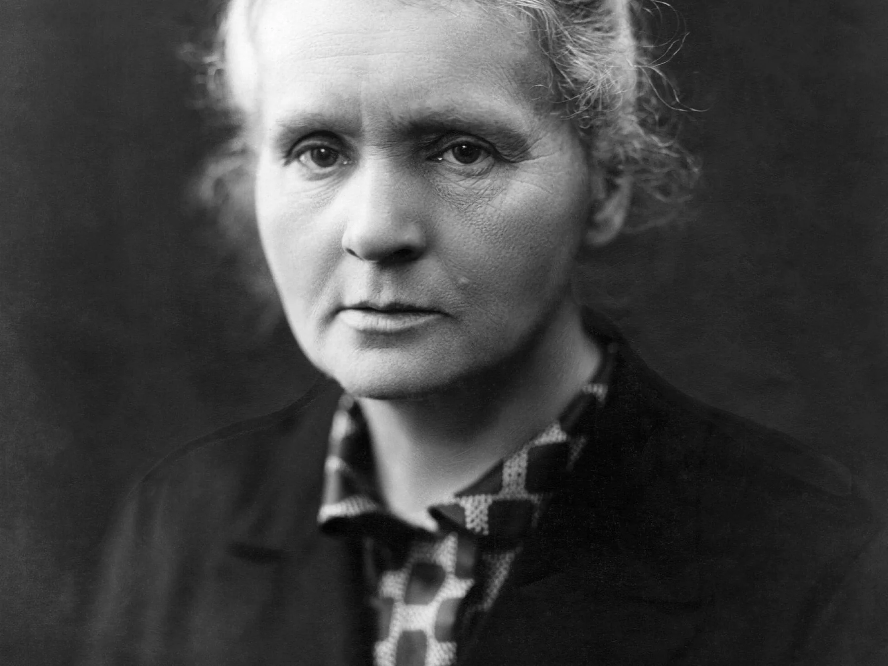 Black-and-white portrait of Marie Curie