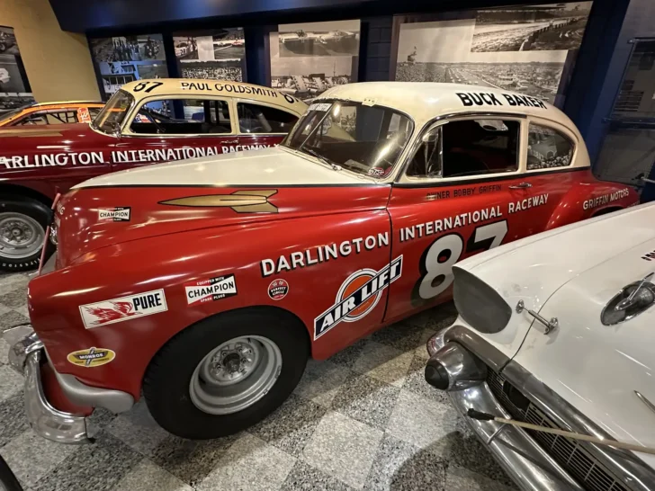 Historic NASCAR stock car displayed at a racing museum