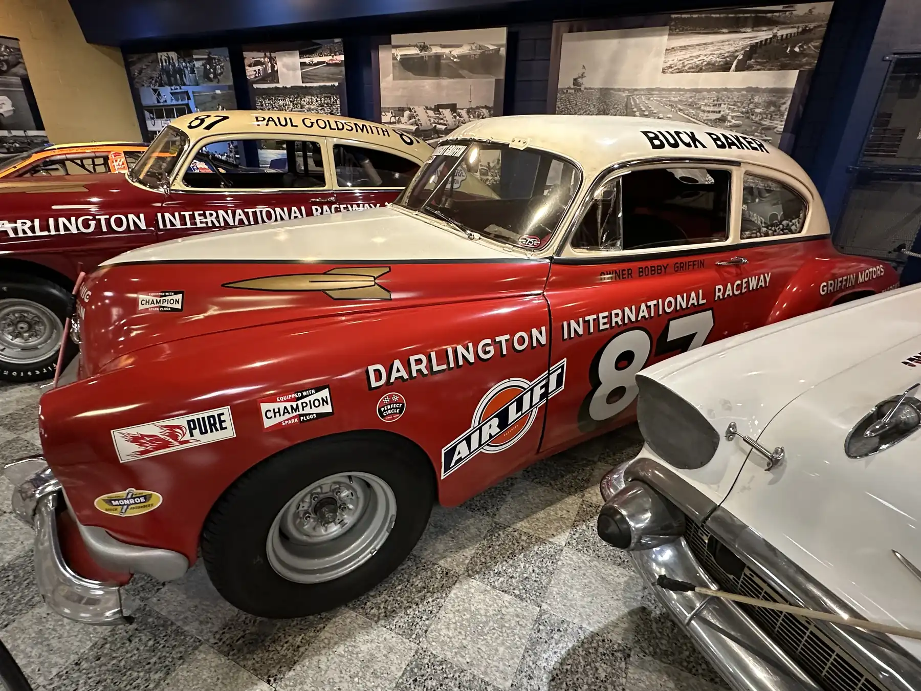 Historic NASCAR stock car displayed at a racing museum