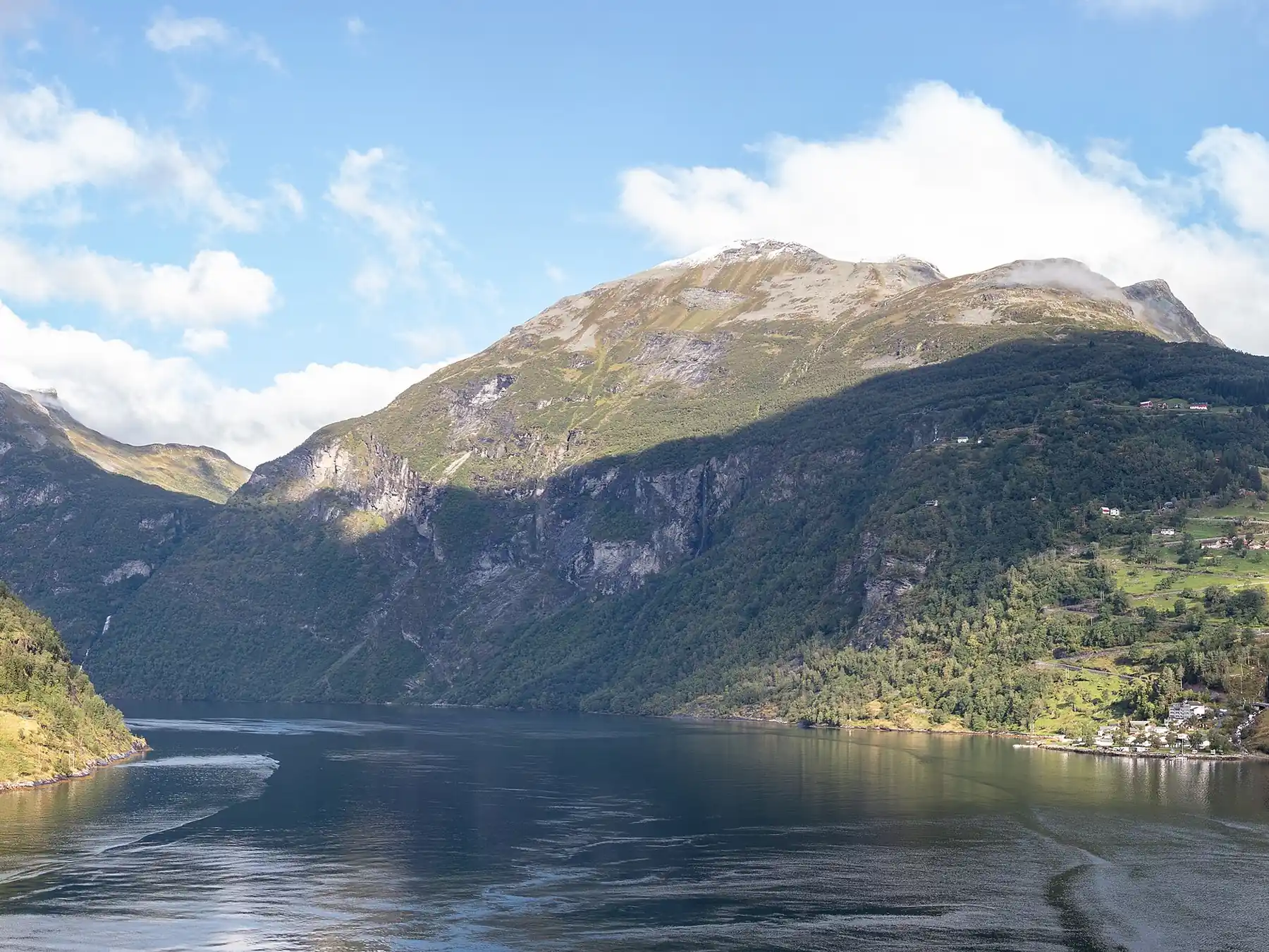 Mountainous fjord landscape in Norway under a blue sky
