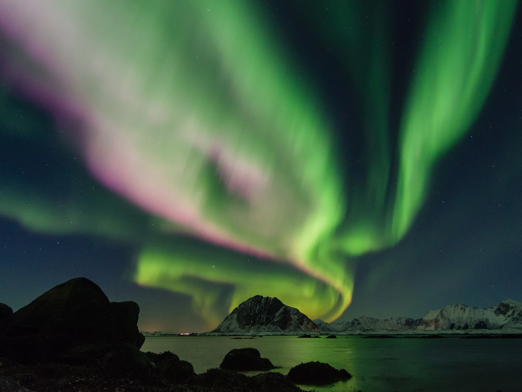 Green northern lights above the Norwegian coast