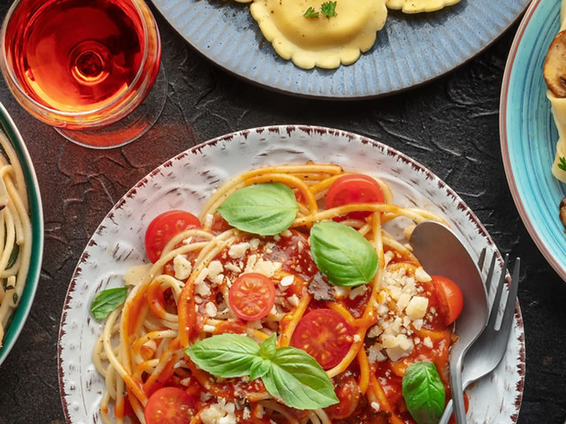 Spaghetti with tomatoes, basil, and grated cheese