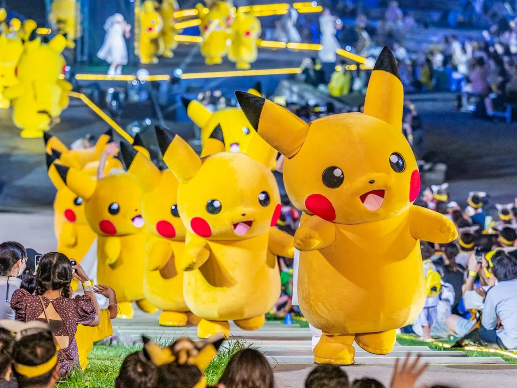 Pikachu mascots appearing at a Pokémon event