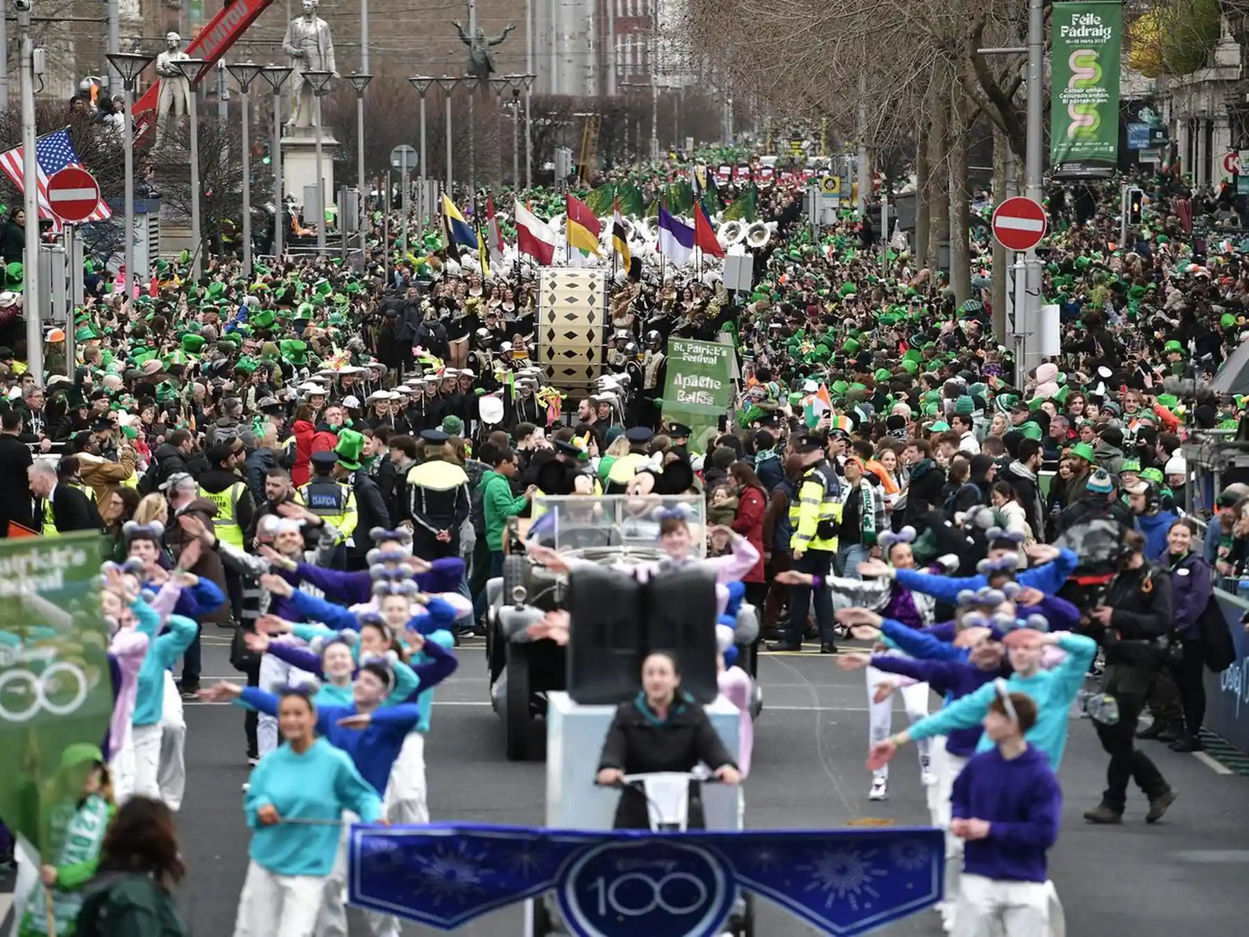 Crowds and performers filling a Dublin street for the St. Patrick’s Day parade