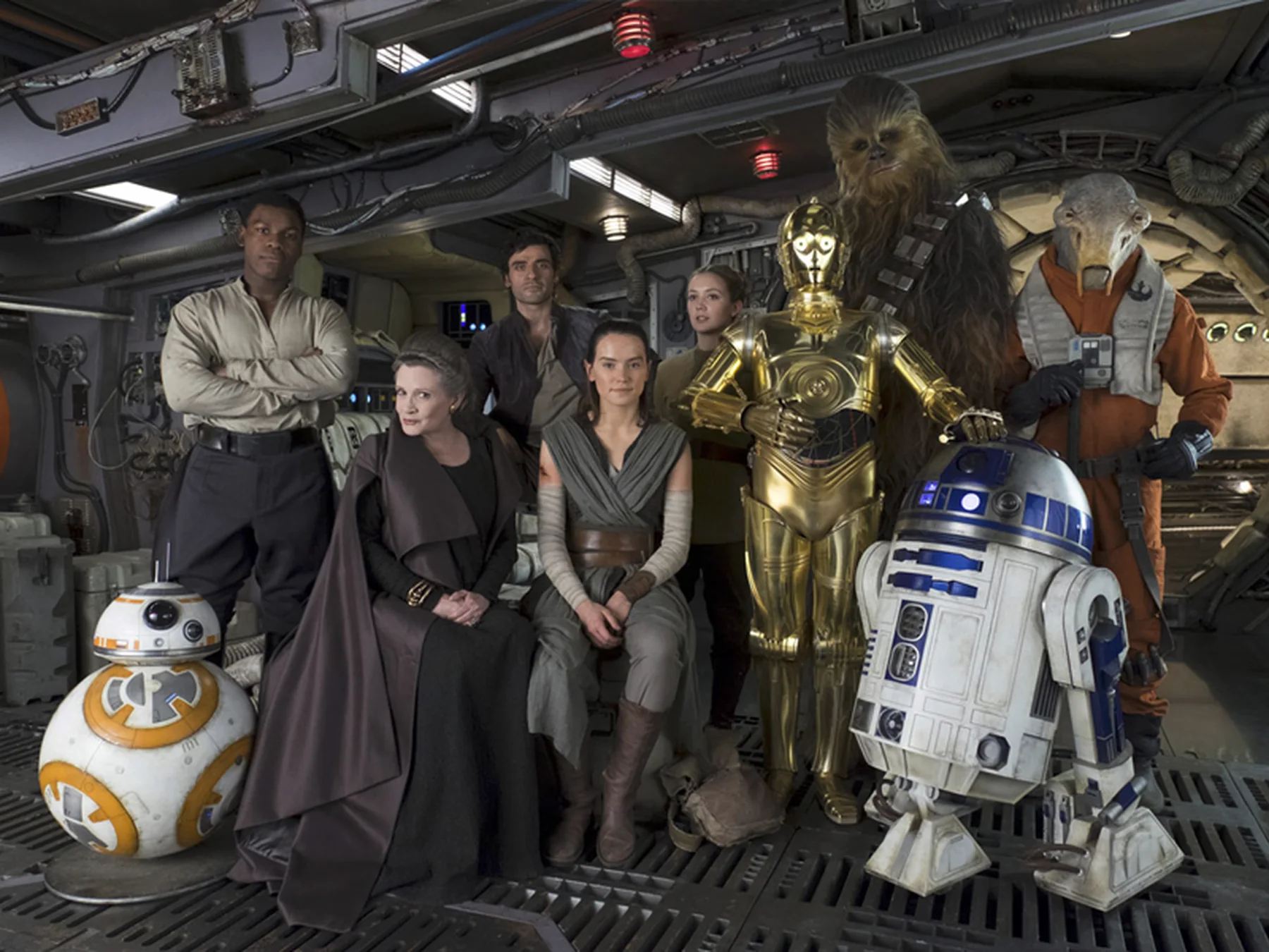 Star Wars heroes and droids gathered inside a spacecraft