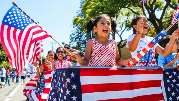 Children enjoying a large American street parade