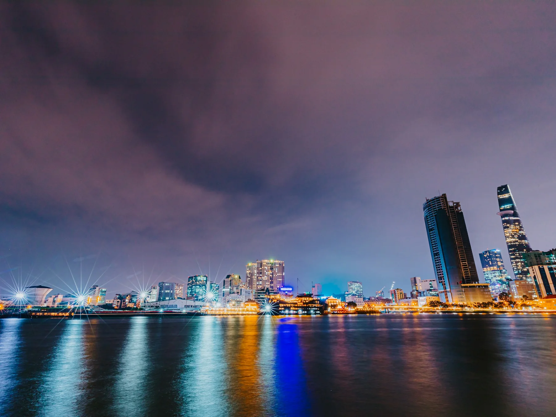 Illuminated waterfront skyline in Vietnam