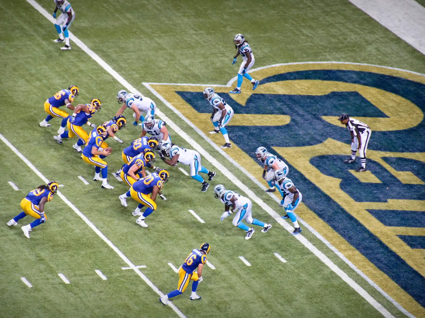 NFL teams lined up before the snap on the football field