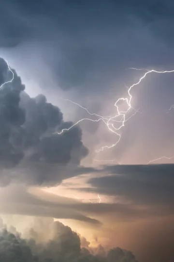 Bright lightning bolts during a nighttime thunderstorm