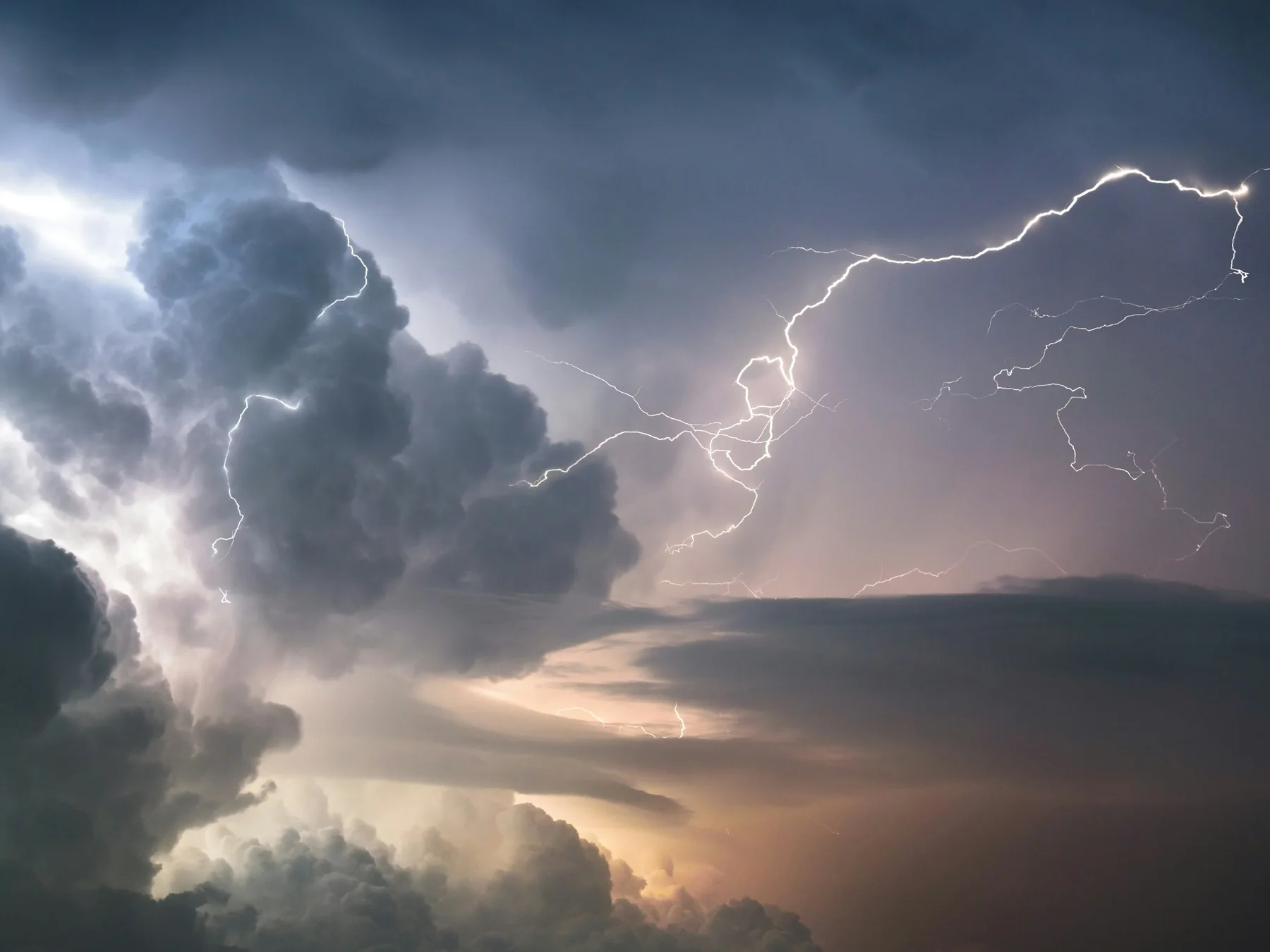 Bright lightning bolts during a nighttime thunderstorm