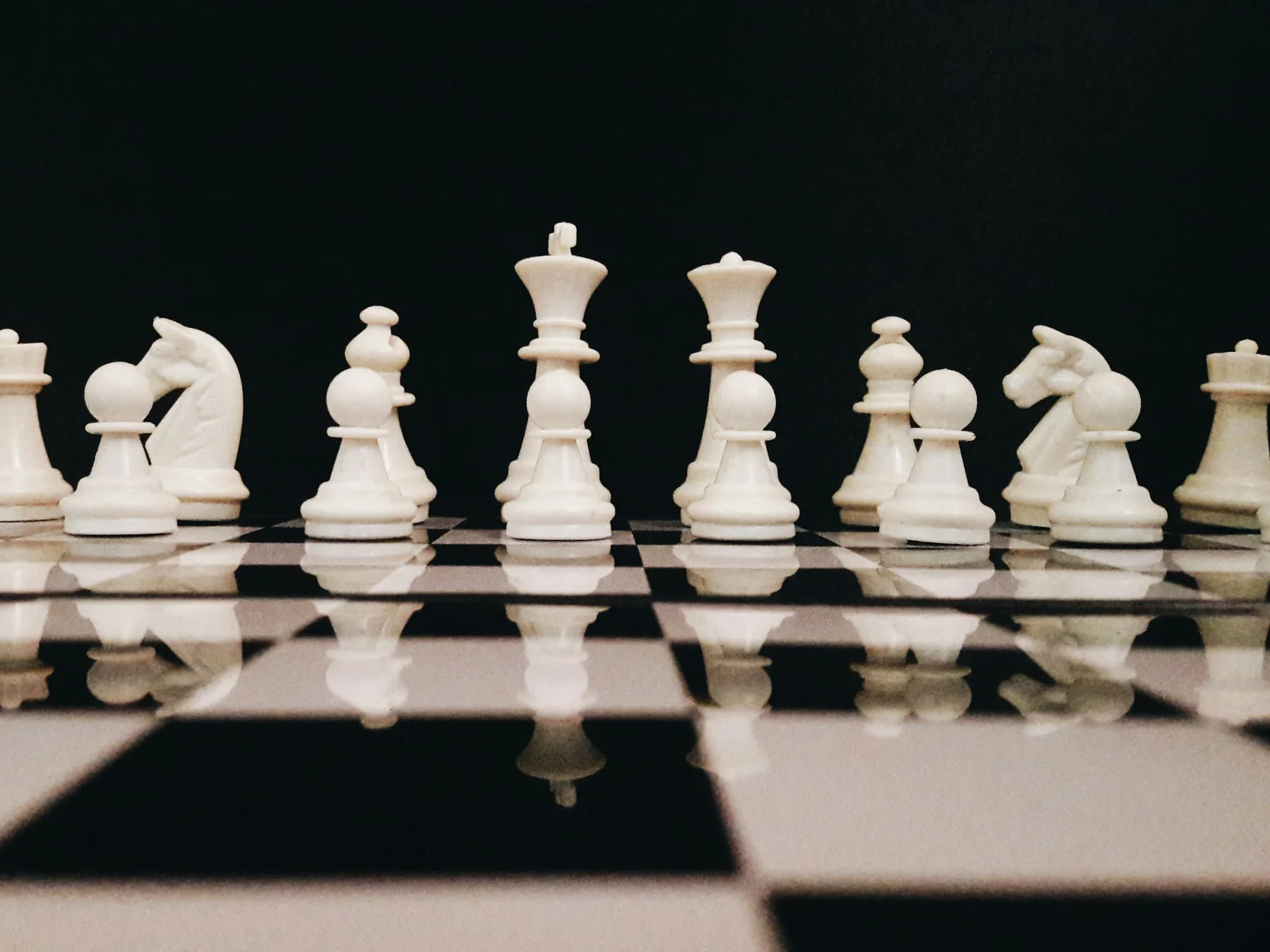 White chess pieces on a board