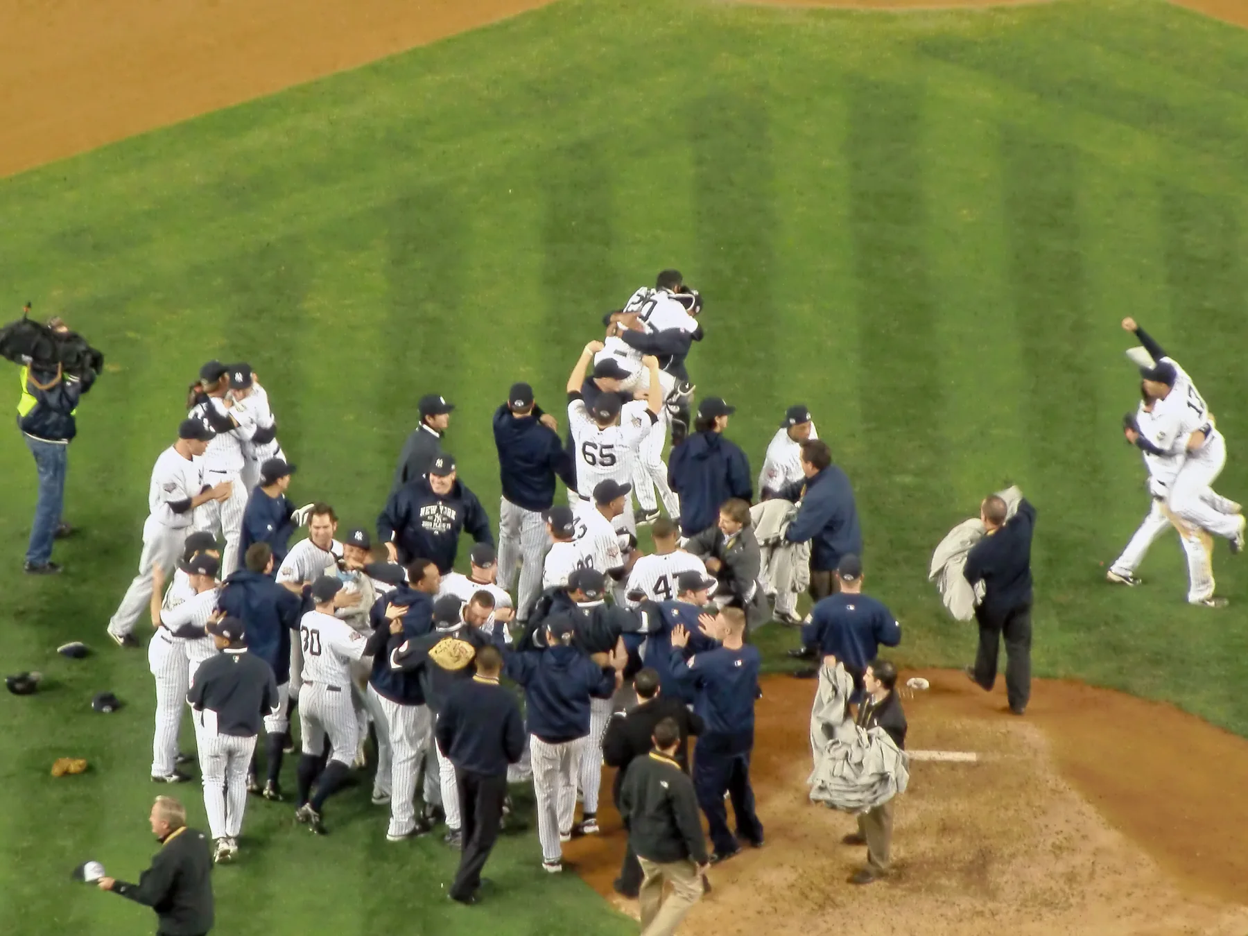 Baseball players celebrating together after a World Series win