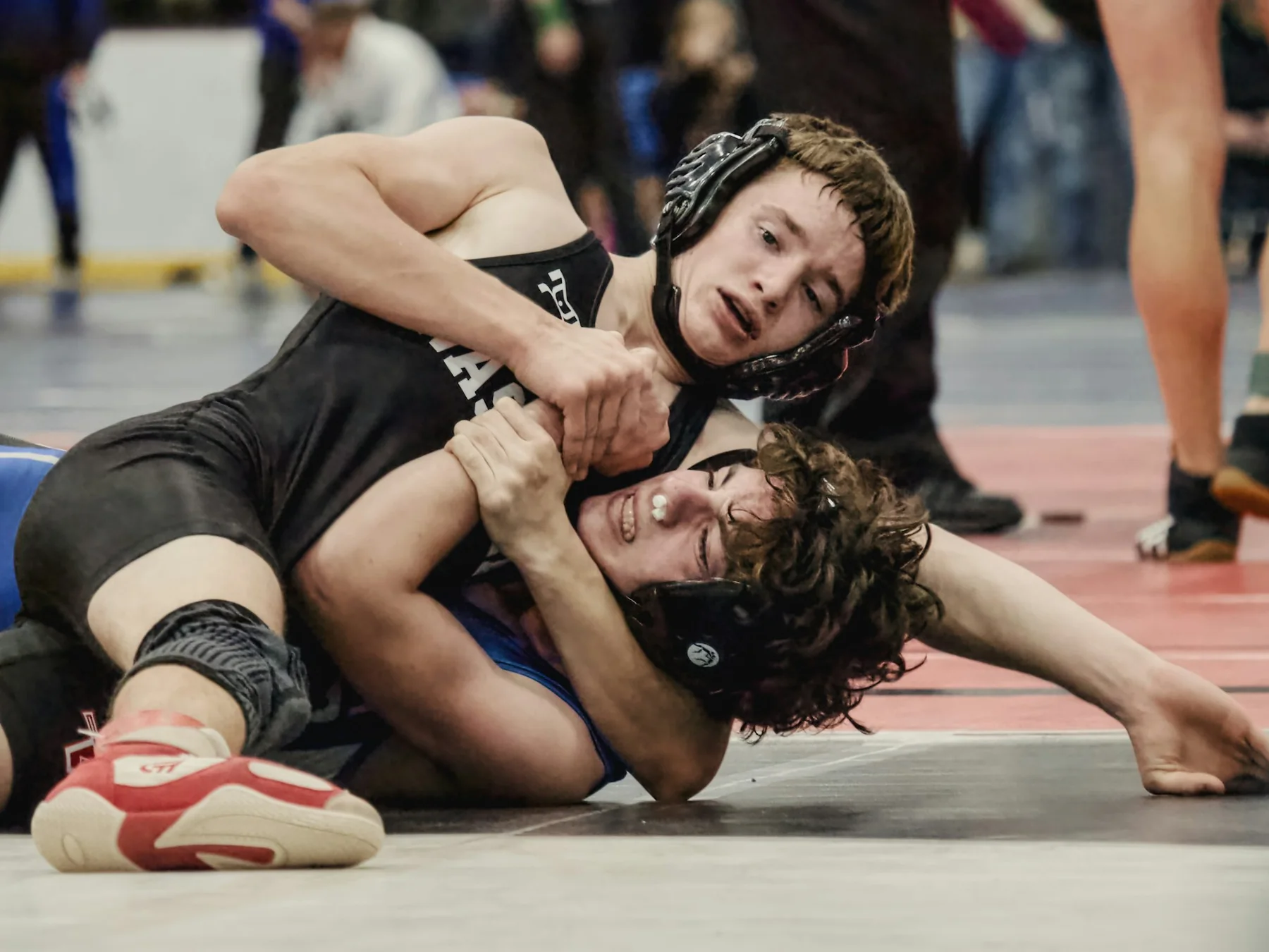 Wrestlers training together in a gym