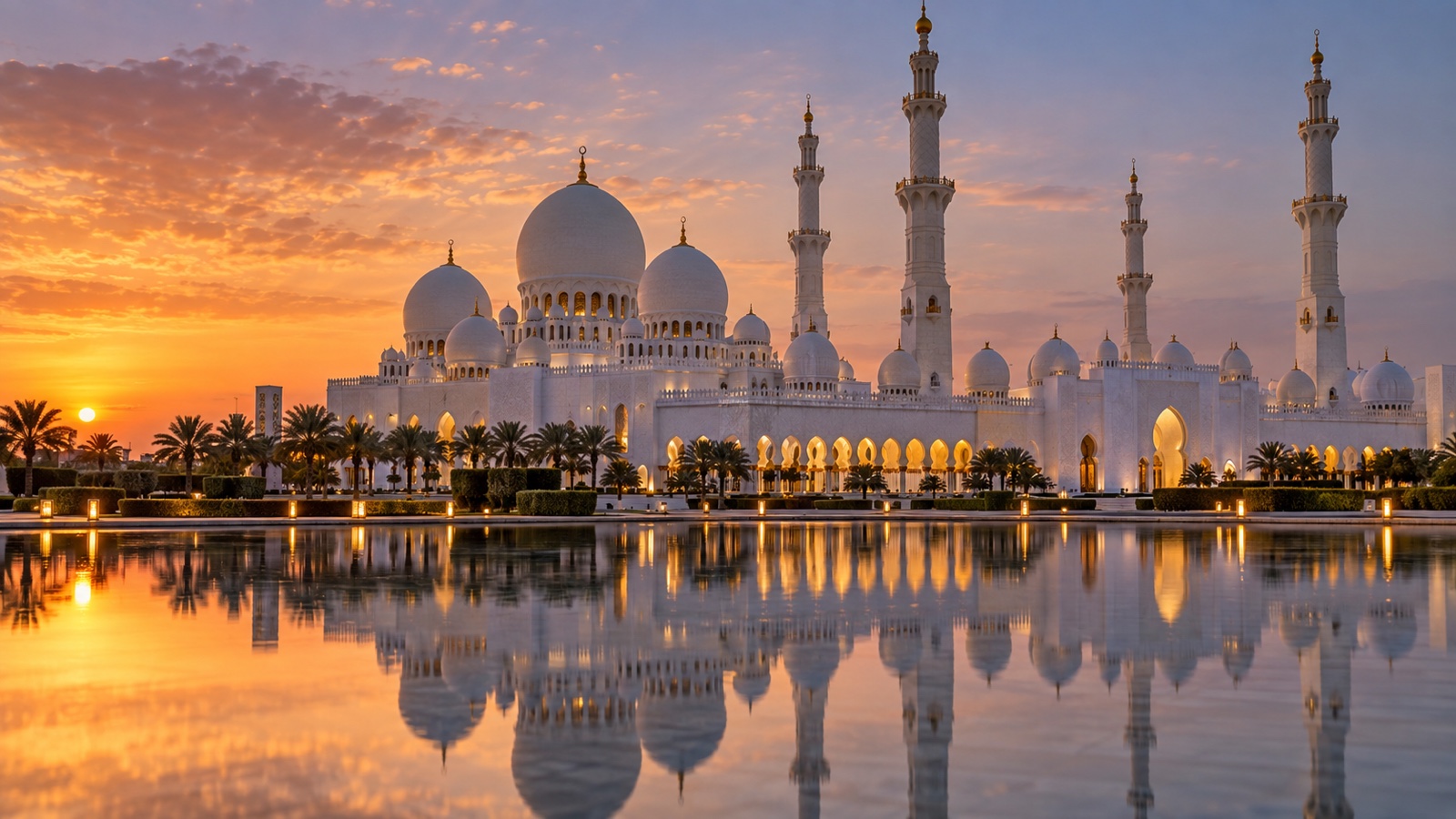 Abu Dhabi Sheikh Zayed Grand Mosque exterior reflected in water at dusk