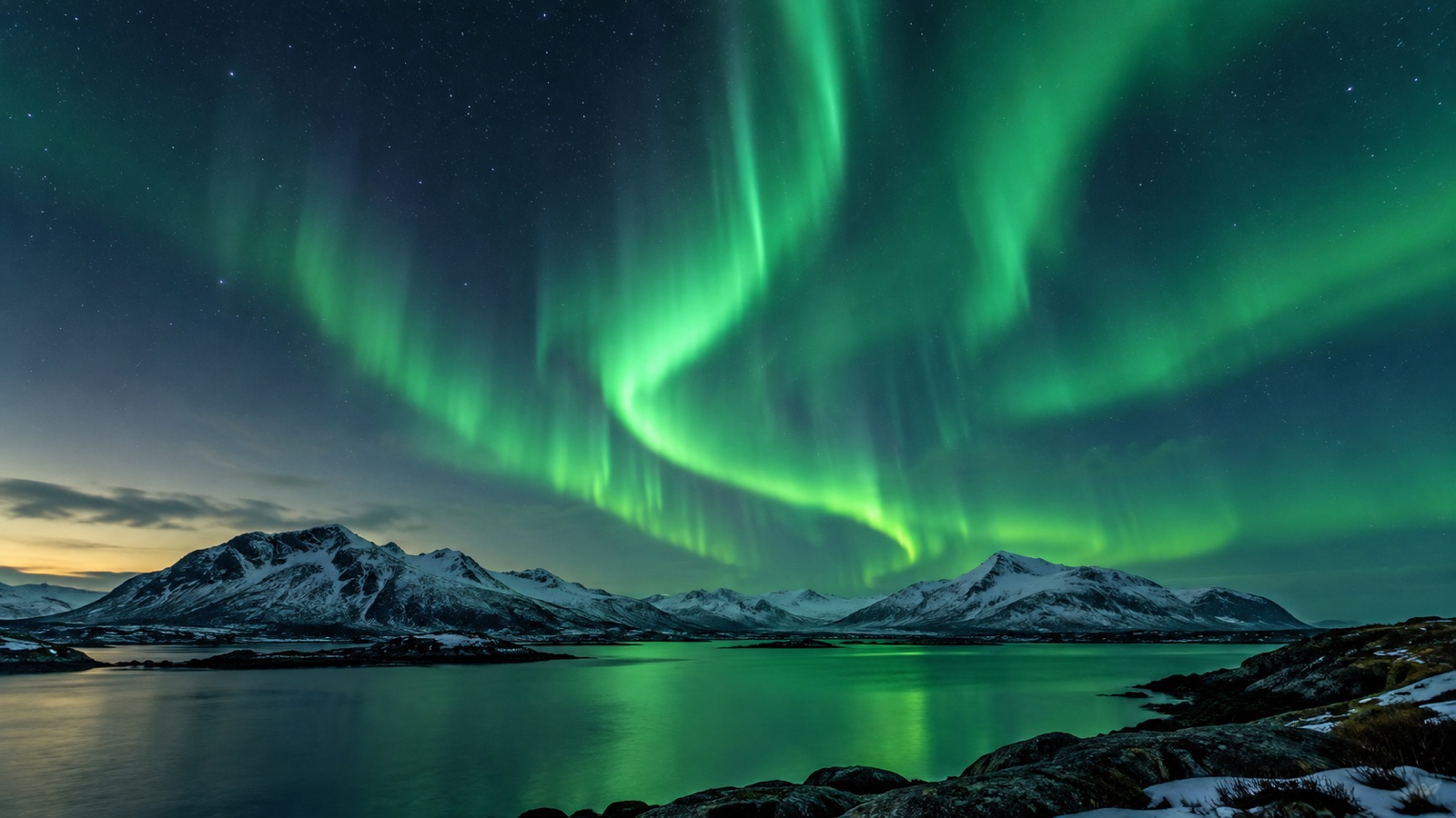 Green aurora above a northern landscape showing Earth's magnetic interaction